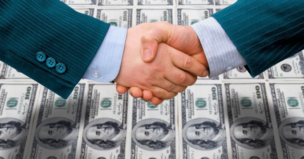 Handshake over money.